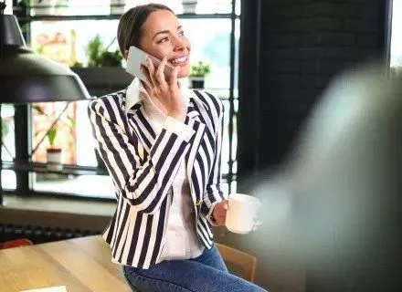 A woman calling over a phone